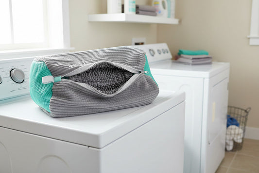 Grey shoe wash bag on top of washing machine