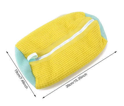 Yellow and blue padded shoe wash bag protecting sneakers in the washing machine